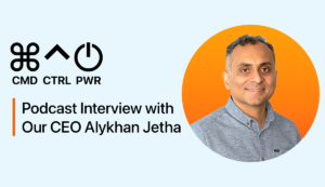 Headshot of our CEO Alykhan Jetha smiling, wearing a grey button-up.